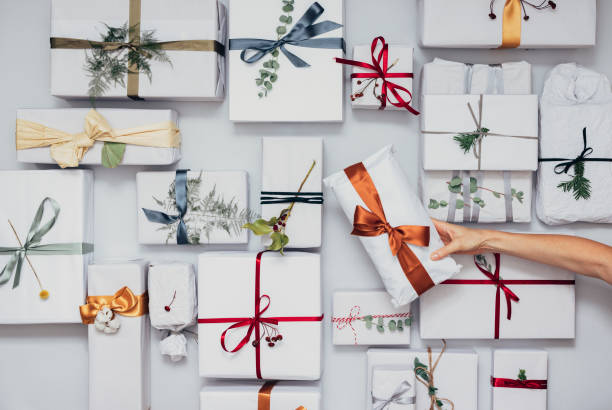 istock Christmas Theme: Top View of Female Hands Holding Christmas Present 1339349989