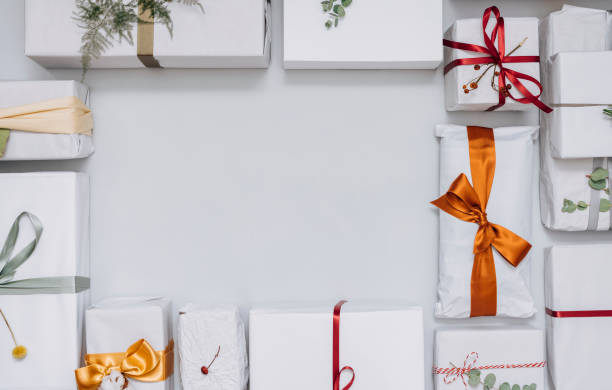 istock Christmas Theme: Top View of Christmas Presents on a White Table 1339350014