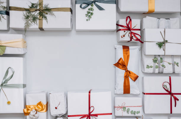 istock Christmas Theme: Top View of Christmas Presents on a White Table 1339350016