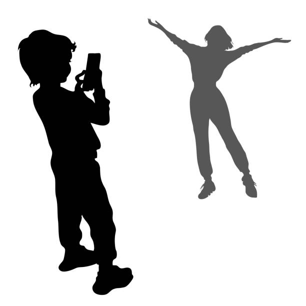 2 vector silhouettes. Girl posing with arms outstretched to the sides. Black silhouette of a little boy, a child stands on the phone to his mother 2 vector silhouettes. Girl posing with arms outstretched to the sides. Black silhouette of a little boy, a child stands on the phone to his mother. playground photos stock illustrations