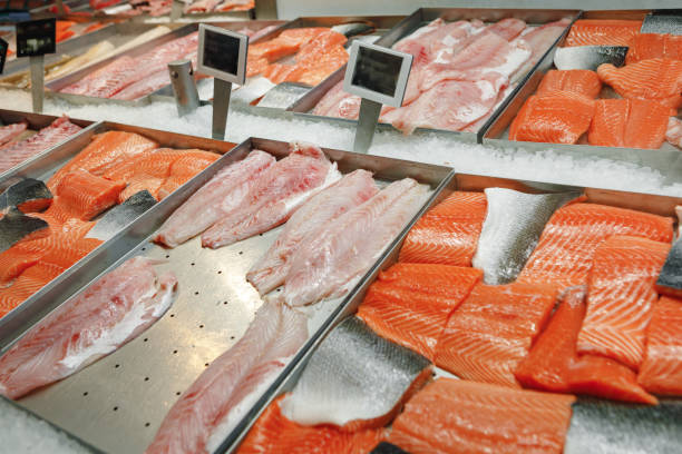 istock Fresh fish assorted on ice counter in supermarket 1339357125