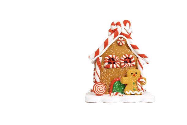 istock Christmas gingerbread house with gingerbread man isolated on white background 1339357811