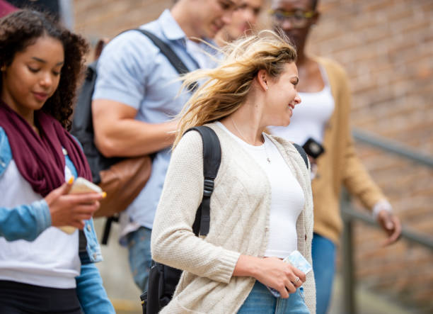 istock Diverse group of university students walking on campus 1339358400