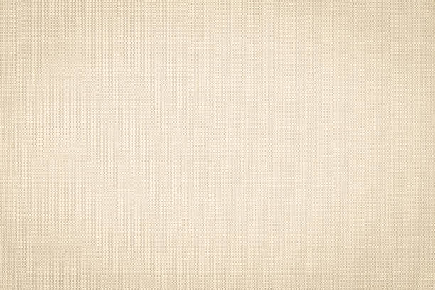 istock Cotton silk fabric wallpaper texture pattern background in light pale cream beige color 1339360976