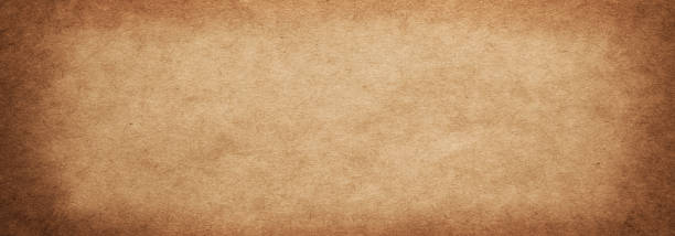 istock The texture of old rough brown paper with a vignette 1339362688