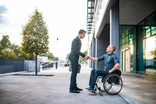 istock Mid Adult Business Professional Shaking Hands with Client 1339362783