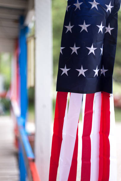 istock US Ribbon Flag Hanging Close-Up 1339366936
