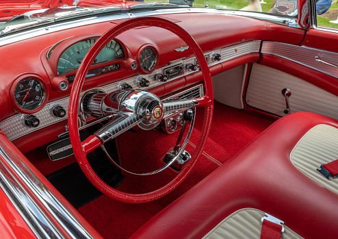 Westlake, Texas, USA - October 18, 2014: A red 1949 Plymouth is on display at the 4th Annual Westlake Classic Car Show. Closeup of front view.