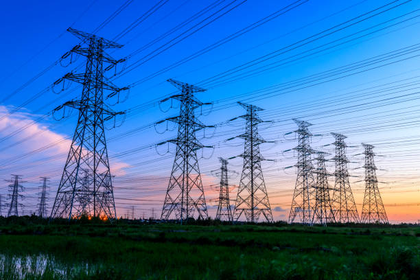 istock High voltage power tower industrial landscape at sunrise. 1339372673