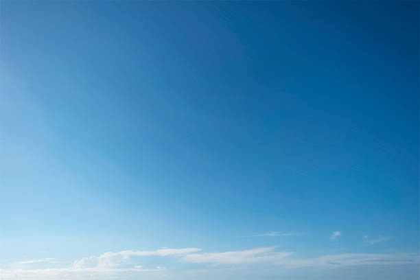 istock The blue sky is tinged with white clouds in the air on a bright summer day. 1339376479