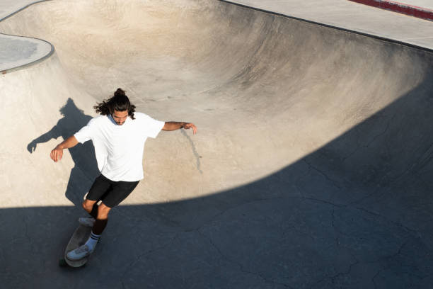 istock Skating inside the bowl at the skate park 1339384054