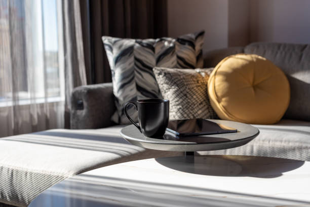 istock Black coffee cup and digital tablet on a table in a modern stylish room 1339386020