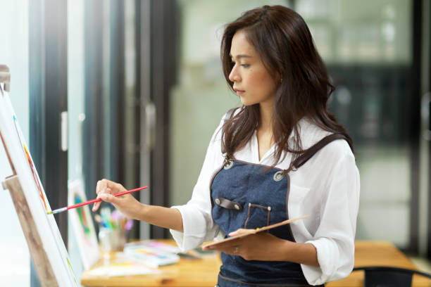 istock Creative positive woman painter, thoughtful artist 1339387055