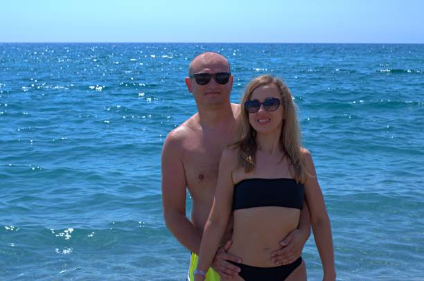 istock Couple hugging by the sea 1339387697