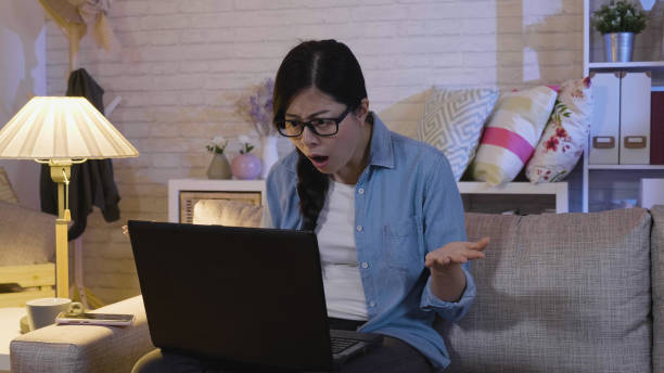 istock asian woman looking laptop confused 1339387832