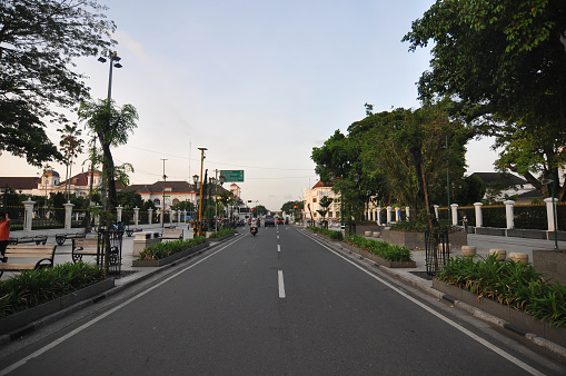 Malioboro street at Yogyakarta, Indonesia, in the early morning with a few vehicles