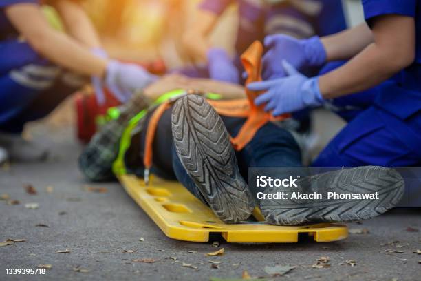 Team Paramedic Firs Aid Accident On Road Ambulance Emergency Service Stock Photo - Download Image Now