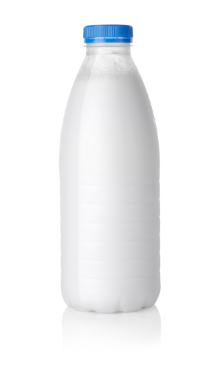 Plastic bottle of milk isolated on white background Path