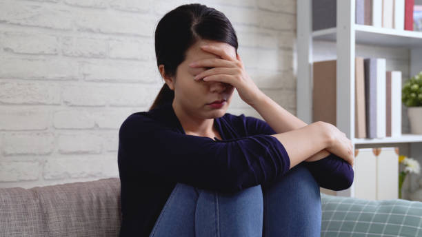 istock sad woman in despair on the sofa 1339402312