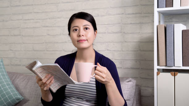 istock asian wife enjoy break time with favorite book 1339402401