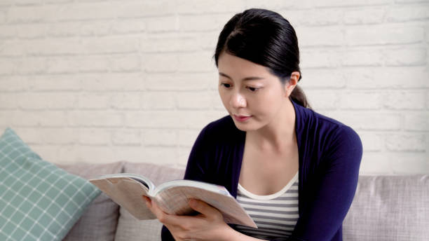 istock elegant asian woman enjoy book 1339402457