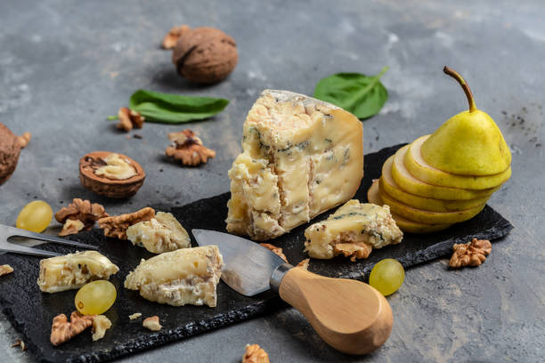 istock French blue cheese Roquefort, made from sheep milk with walnuts honey and pear. top view 1339402475