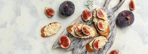 istock Sandwiches with ricotta cheese, figs, Delicious appetizer, ideal aperitif. top view 1339402516