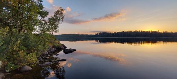 istock Beautiful sunset on a swedish lake with a smiling cloud 1339404761