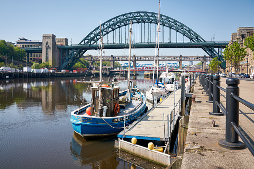 Fishing trawler moored on Newcastle Quayside with the Tyne Bridge in the background.