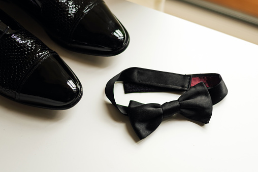 Groom dressing up with classic elegant shoes. Groom's accessories