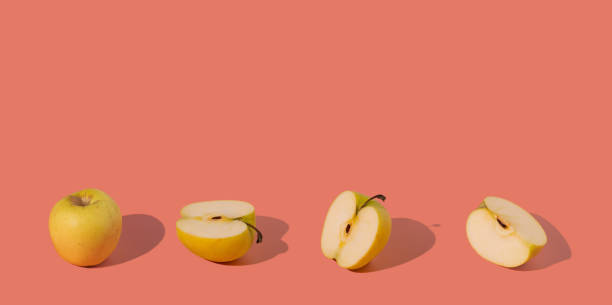 istock yellow juicy summer apples on a pink background 1339409408