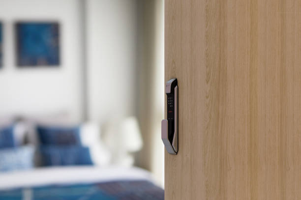 istock Digital Door handle or Electronics knob for access to room security, Door wooden half opening through interior living room background, 1339409592