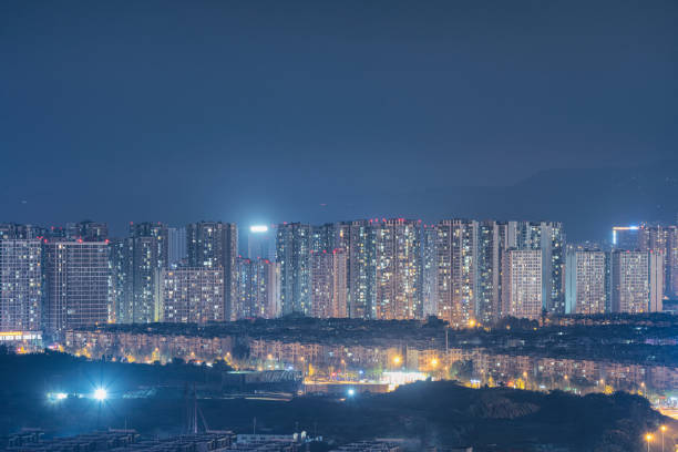 istock Half - night lighted modern apartments and overpasses 1339409733