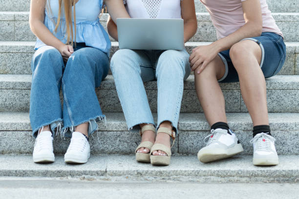 istock Closeup of students working on a laptop. 1339413526
