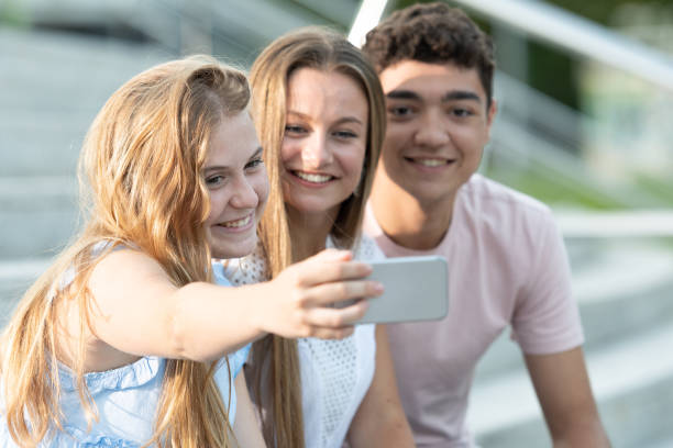 istock Multiethnic teenagers taking a selfie 1339413579