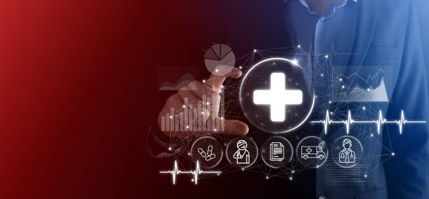 istock Businessman hold virtual plus medical network connection icons. Covid-19 pandemic develop people awareness and spread attention on their healthcare.Doctor,document,medicine,ambulance,patient icon. 1339415480