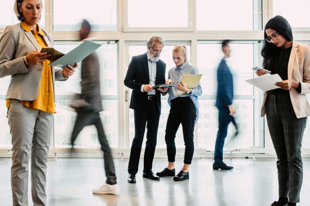 istock Business people discussing in the corridor 1339417288