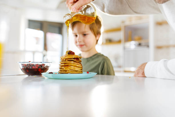 istock Pancakes with syrup for you son! 1339419644