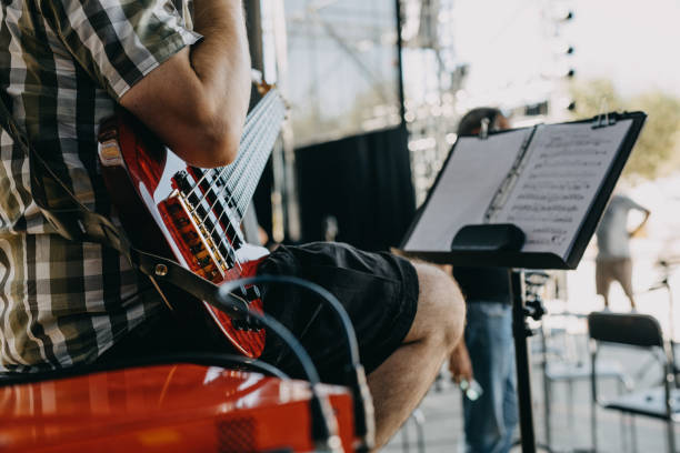 istock Mid Section Playing Bass Guitar 1339420211