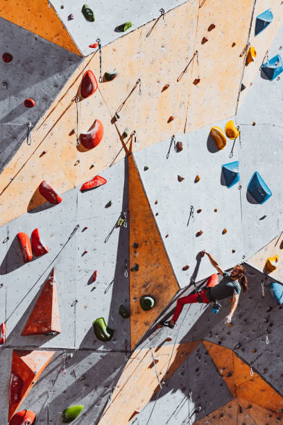 istock One Caucasian man professional rock climber practicing alone at training center in sunny day, outdoors. Concept of healthy lifestyle, tourism, nature, motion. 1339422251