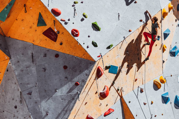 istock One Caucasian man professional rock climber practicing alone at training center in sunny day, outdoors. Concept of healthy lifestyle, tourism, nature, motion. 1339422260