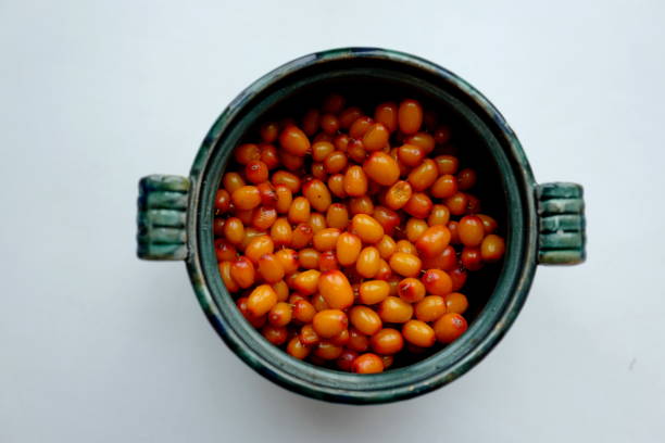 istock Sea buckthorn berries in a green round cup. 1339430832