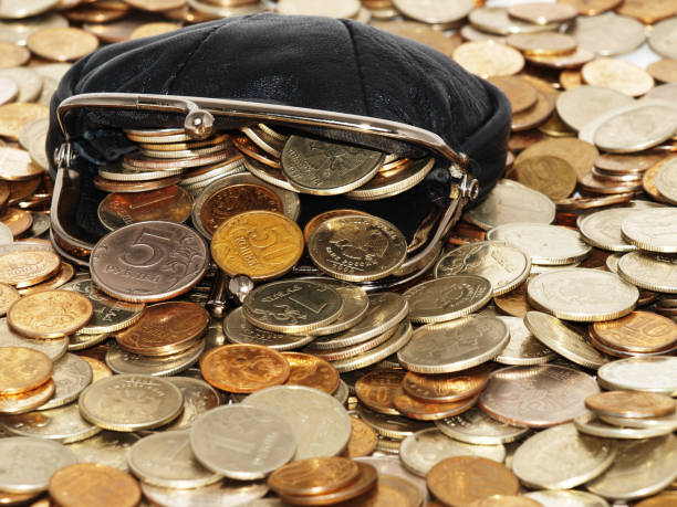 istock A large black wallet is bathed in gold coins. 1339431954