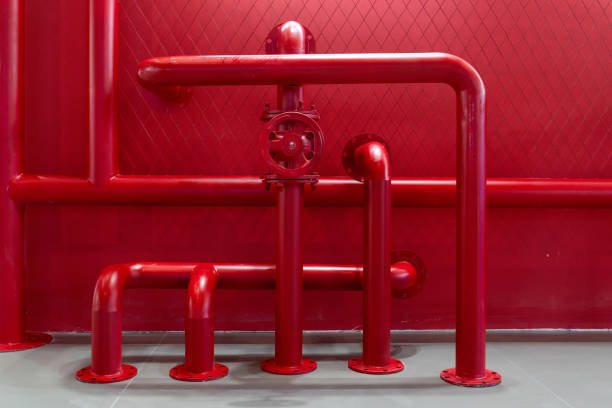 red pipeline and valve in factory.