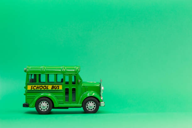 istock school bus green toy on green background 1339433456