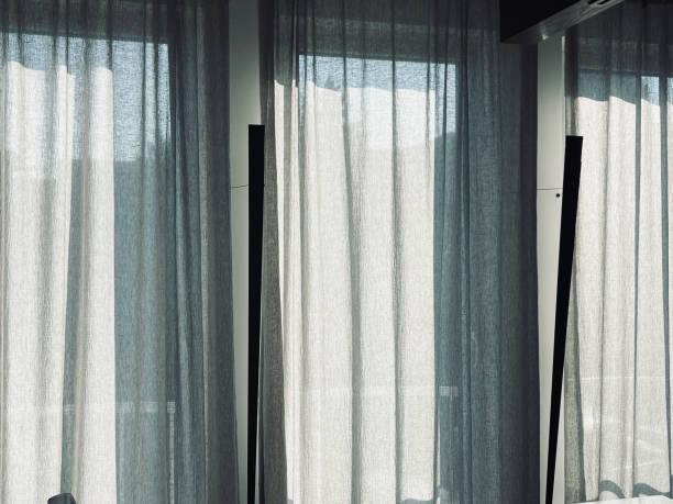 istock Morning sun behind curtains 1339433569