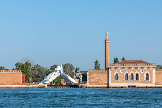 Lorenzo Quinn's Giant Stone Hands Represent Humanity’s Universal Values At Venice Art Biennale in Venice, Italy Venice, Italy - July 6, 2021: Lorenzo Quinn's Giant Stone Hands Represent Humanity’s Universal Values At Venice Art Biennale in Venice, Italy. venice biennale stock pictures, royalty-free photos & images