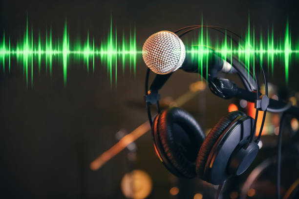 istock Headphones, microphone and radio wave on dark background 1339435266