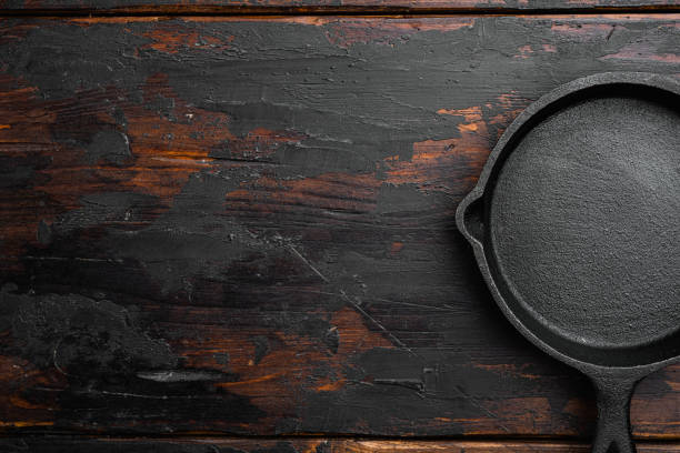 Black icast iron skillet or cooking pan isolated on white