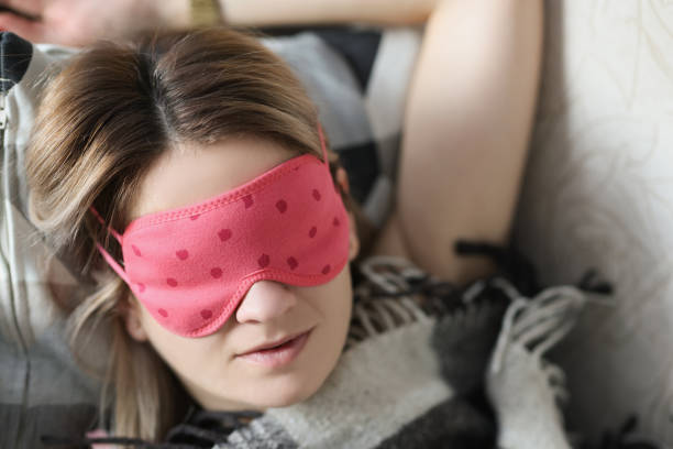 istock Young beautiful woman sleeping in bed with eye mask 1339436851